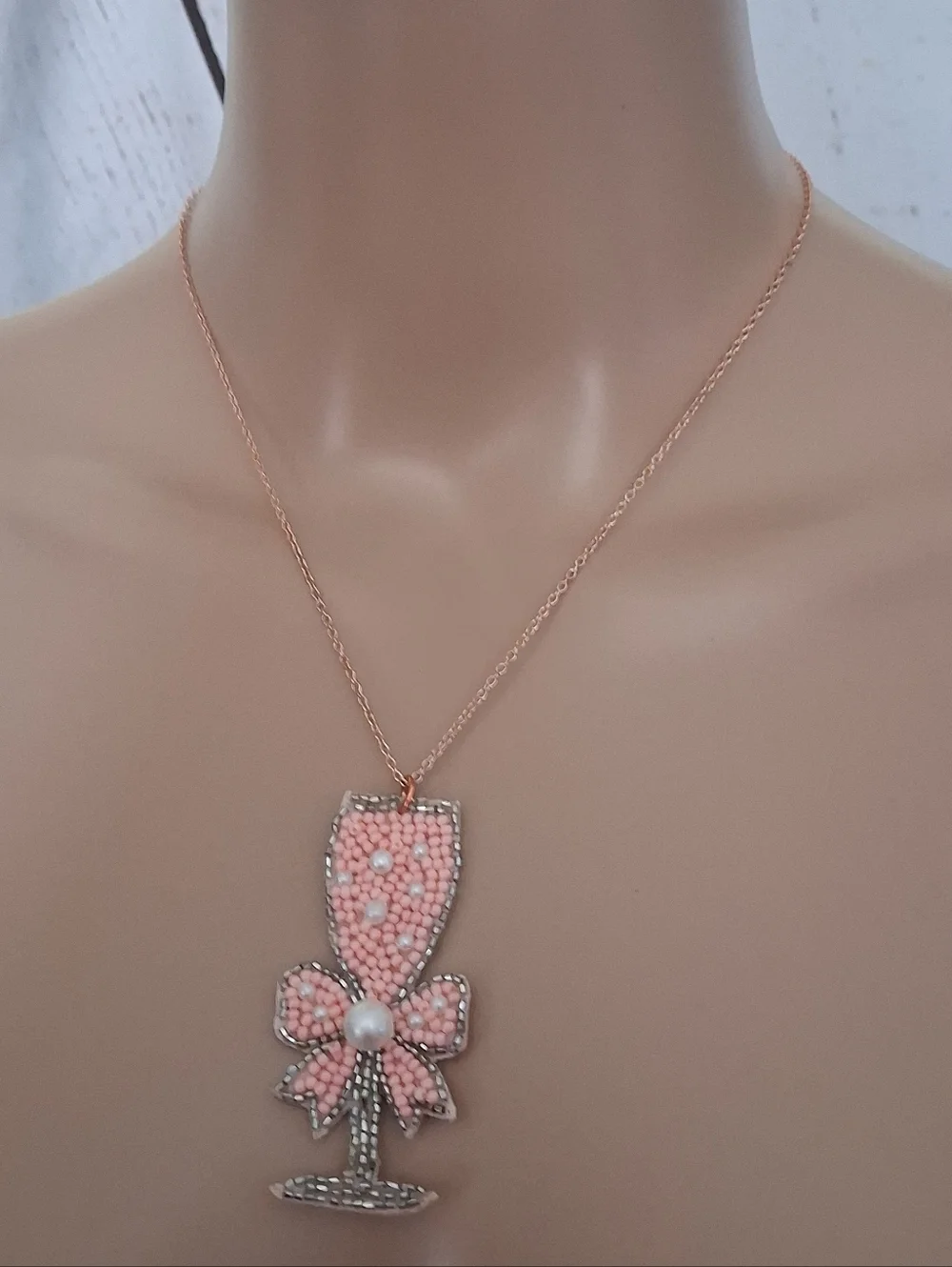 Pink Beaded Champagne Glass Pendant Necklace On A Rose Gold Chain.
